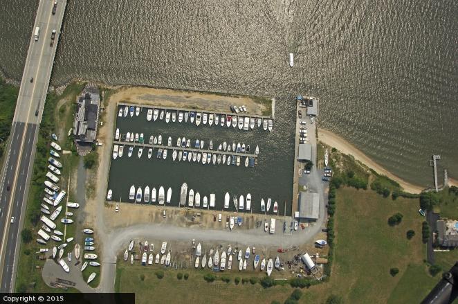 An aerial view of a marina with boats parked in it.