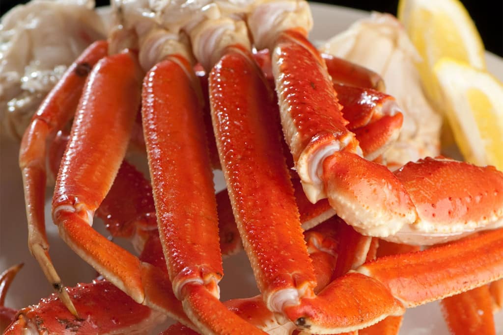 A close up of crab legs on a plate